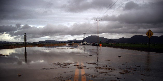 Water covers a closed Las Posas Road near Camarillo, Calif., after heavy rain from the first in a series of El Nino storms pa
