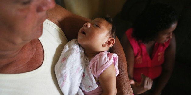 RECIFE, BRAZIL - JANUARY 27: Alice Vitoria Gomes Bezerra, 3-months-old, who has microcephaly, is held by her father Joao Bati