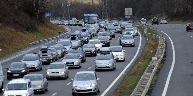 Vehicles drive at reduced speed on February 13, 2016 on the A43 highway near Chignin towards ski resorts during a crossover o