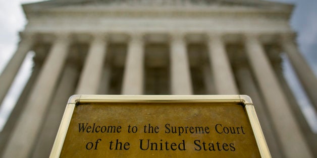 UNITED STATES - JUNE 30 - A sign welcomes visitors to the front steps of the Supreme Court in Washington on Tuesday, June 30, 2015. (Photo By Al Drago/CQ Roll Call)