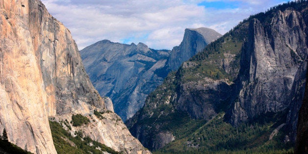 FILE - In this Oct. 2, 2013 file photo taken by Tammy Webber, a scenic view on her way to Glacier Point trail in the Yosemite National Park, Calif. is seen. The National Park Service announced late Wednesday night Oct. 16, 2013 that major highways and roads leading into and through the park are immediately open to vehicles. (AP Photo/Tammy Webber)