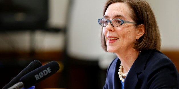 Gov. Kate Brown talks with members of the media to preview legislation for the upcoming session at the Capitol Building, in Salem, Ore., on Tuesday, Jan. 26, 2016. (AP Photo/Timothy J. Gonzalez)