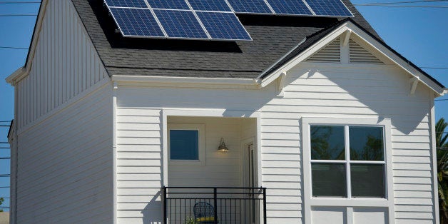 Solar panels sit on the roof of the model home at the Pacific Housing Inc. 2500 R Midtown housing development site in Sacrame
