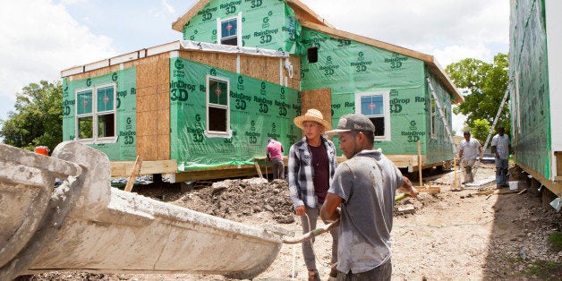 NEW ORLEANS, LA - MAY 28: Construction workers from Honduras and Mexico work on new houses in the Lower Ninth Ward, on May 28, 2015 in New Orleans, Louisiana. This neighborhood was destroyed when the nearby industrial canal levy broke during hurricane Katrina. Brad Pitt's Make it Right Foundation has been building many homes in this area - including these. The foundation builds sustainable homes for people in need. It has been almost 10 years since Katrina hit New Orleans, devastating many neighborhoods. Rebuilding has been slow and controversial. (Photo by Melanie Stetson Freeman/The Christian Science Monitor via Getty Images)