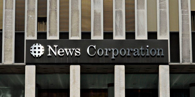 UNITED STATES - AUGUST 01: Sunlight reflects off a News Corporation sign on the facade of News Corp. headquarters in New York, Wednesday, Aug. 1, 2007. Rupert Murdoch's News Corp. agreed to buy Dow Jones & Co. for $5.2 billion, gaining control of the Wall Street Journal and ending the Bancroft family's 105 years of stewardship. (Photo by Jonathan Fickies/Bloomberg via Getty Images)