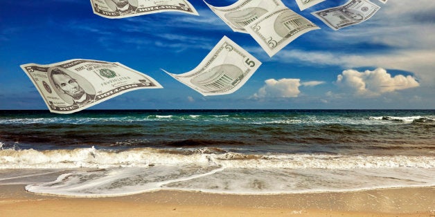 Tax Haven. Dollar bills on a sunny beach... The Panama Papers : more than 11 million documents, which date back four decades, are allegedly connected to a Panama law firm.