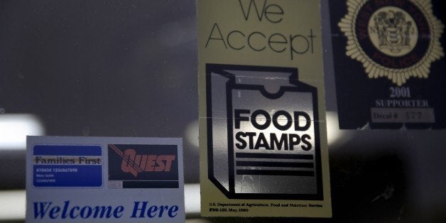 A supermarket displays stickers indicating they accept food stamps in West New York, N.J., Monday, Jan. 12, 2015. New Jersey