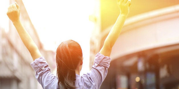 young asian woman open arms on the shopping street