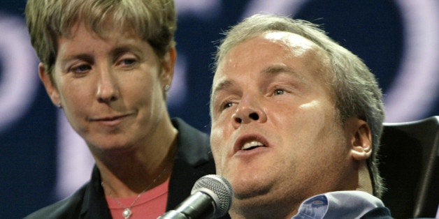 Disabled New York City police officer Steven McDonald is assisted by his wife Patti Ann as he speaks during the second night of the 2004 Republican National Convention at Madison Square Garden in New York City, August 31, 2004. Convention delegates will formally nominate U. S. President George W. Bush during the session, and Bush will formally accept the nomination September 2. McDonald was paralyzed from the neck down after being shot on duty in 1986. REUTERS/Brian Snyder US ELECTION JM