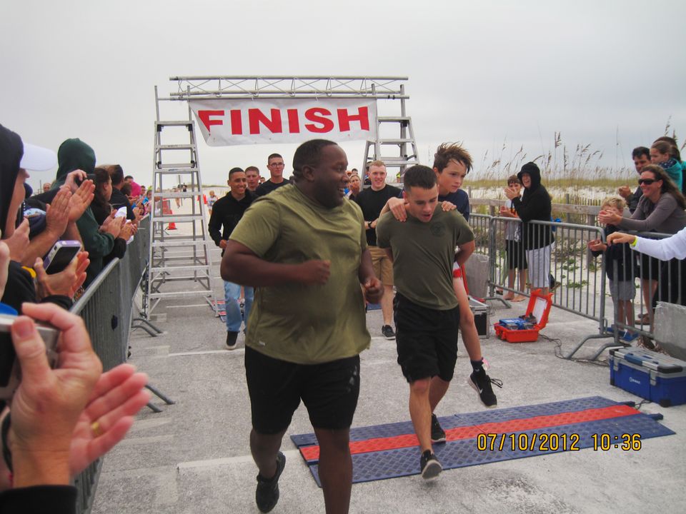 Marines Carry Disabled Boy Across Marathon Finish Line