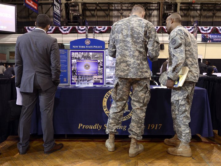 Soldiers at the New York State Police booth during the “Hiring Our Heroes – New York,” hiring fair for veterans and military spouses hosted by the New York Army National Guard at the 69th Regiment Armory March 27, 2013. The US Chamber of Commerce’s National Chamber Foundation, and lead sponsors Capital One Financial Corporation and Toyota, will celebrate the two-year anniversary of the Hiring Our Heroes program and more than 100 employers with jobs available for veterans and military spouses are at the fair . AFP PHOTO / TIMOTHY A. CLARY (Photo credit should read TIMOTHY A. CLARY/AFP/Getty Images)