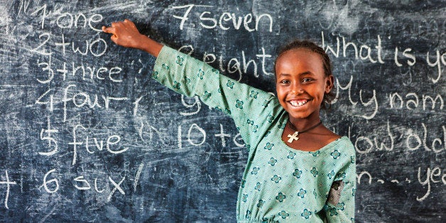 African little girl during her english class