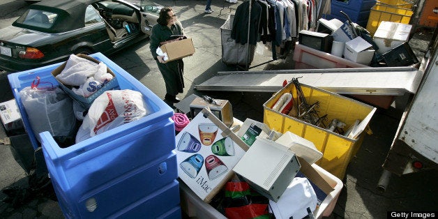 ARLINGTON, VA - DECEMBER 30: A woman drops off donated items at a Goodwill Industries of Greater Washington location December 30, 2005 in Arlington, Virginia. Charity organizations like Goodwill see a surge in donations at the end of the calendar year before the 2005 tax deduction deadline. With 84-percent of its $2.39 billion in revenue going to fund social benefit programs and services, Goodwill helped place 104,010 people in jobs outside the organization in 2004. (Photo by Chip Somodevilla/Getty Images)