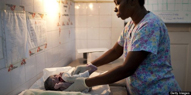 PORT AU PRINCE, HAITI - FEBRUARY 2011: At a government maternity hospital run by MSF (Doctors Without Borders) February 2011 in Port au Prince, Haiti. Many of the women giving birth at this hospital are living in neighboring tent camp. (Photo by Jonathan Torgovnik/Getty Images)
