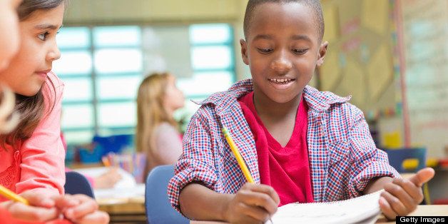 Kindergarten or preschool students reading and writing in public school 