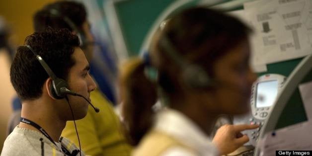 Indian workers answer telephone calls at a call-centre in Gurgaon on the outskirts of New Delhi on December 5, 2008. Delhi, the capital of India, is the site of seven principal cities built throughout the centuries by different rulers who came and conquered, establishing their presence with grandiose buildings, some of which lie in ruins amonst the sprawling urban mass that the city is today. As the nation carves out an increasingly significant role in the global economy, modern day Delhi is slowly being conquered once more as a new urban elite make their mark on the landscapes and lifestyles of the city. AFP PHOTO/Findlay KEMBER (Photo credit should read FINDLAY KEMBER/AFP/Getty Images)