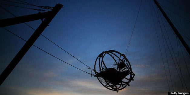 SEASIDE HEIGHTS, NJ - NOVEMBER 25: A broken amusement ride hangs in the air damaged by Superstorm Sandy, on November 25, 2012 in Seaside Heights, New Jersey. New Jersey Gov. Christie estimated that Superstorm Sandy cost New Jersey $29.4 billion in damage and economic losses. (Photo by Mark Wilson/Getty Images)