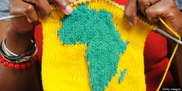 African woman knitting the shape of Africa.