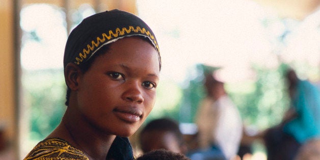 A beautiful African woman and her child wait for a doctors appointment