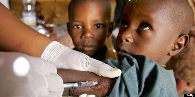 (FILES) This photo dated 17 March 2006 shows a child being vaccinated against meningitis in Tchadoua near Maradi in southwestern Niger. Eight children under the age of 5 die every minute in Africa due to diseases for which there are vaccinations, the UN said 21 August 2007. Most children are dying from polio, tetanus or measles. AFP PHOTO/ISSOUF SANOGO (Photo credit should read ISSOUF SANOGO/AFP/Getty Images)