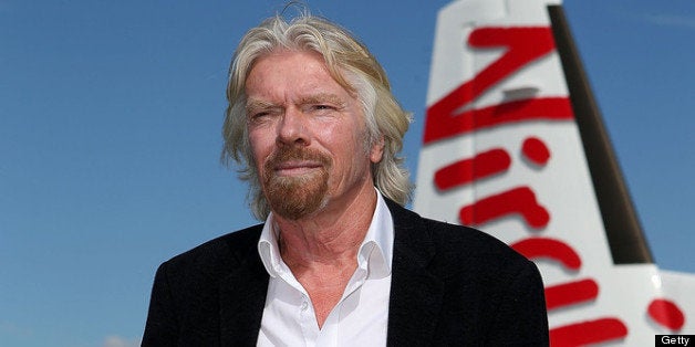 PERTH, AUSTRALIA - MAY 07: Sir Richard Branson conducts a television interview at Perth Airport on May 7, 2013 in Perth, Aus