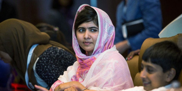 NEW YORK, NY - JULY 12: Malala Yousafzai, the 16-year-old Pakistani advocate for girls education who was shot in the head by the Taliban, attends a conversation with the United Nations Secretary General Ban-ki Moon and other youth delegates at the United Nations Youth Assembly on July 12, 2013 in New York City. The United Nations declared July 12 'Malala Day.' Yousafzai also celebrates her birthday today. (Photo by Andrew Burton/Getty Images)