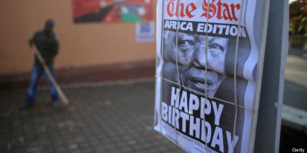 JOHANNESBURG, SOUTH AFRICA - JULY 18: A newspaper flysheet declares 'Happy Birthday' to Nelson Mandela opposite Mandela's former home in Vilakazi Street, Soweto Township on July 18, 2013 in Johannesburg, South Africa. The South African presidency has said that Mandela's health is 'steadily improving', as the anti-apartheid icon began spends his 95th birthday in hospital. Children in schools across the country have started off Mandela Day by singing 'Happy Birthday' to him. (Photo by Christopher Furlong/Getty Images)