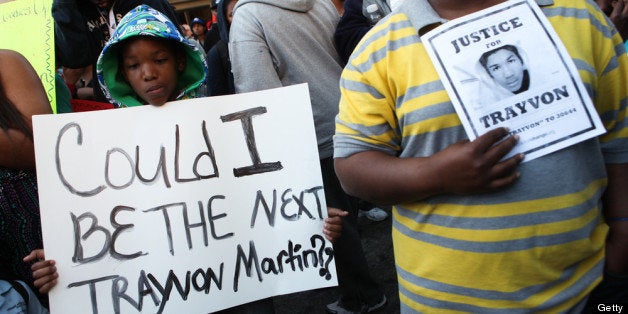 ATLANTA, GA - MARCH 26: Jordan Miller, 10, holds a handmade sign alonside thousands of protesters rallying at the Georgia State Capitol in memory of slain Florida teenager Trayvon Martin on March 26, 2012 in Atlanta, Georgia. Protests have been nationwide in reaction to the death of Trayvon Martin, the Florida teenager whose shooting by a neighborhood watch captain has led to questions of the 'Stand Your Ground' law in Florida and other states. (Photo by Jessica McGowan/Getty Images)