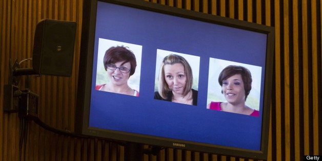 CLEVELAND, OH - AUGUST 1: A screenshot from a video released by the three victims of Ariel Castro, (L-R) Michelle Knight, Amanda Berry and Gina DeJesus, is displayed during Castro's sentencing at the Cleveland Municipal Courthouse on August 1, 2013 in Cleveland, Ohio. Castro was sentenced to life without parole plus one thousand years for abducting the women between 2002 and 2004 when they were between 14 and 21 years old. (Photo by Angelo Merendino/Getty Images)