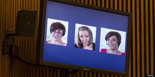 CLEVELAND, OH - AUGUST 1: A screenshot from a video released by the three victims of Ariel Castro, (L-R) Michelle Knight, Amanda Berry and Gina DeJesus, is displayed during Castro's sentencing at the Cleveland Municipal Courthouse on August 1, 2013 in Cleveland, Ohio. Castro was sentenced to life without parole plus one thousand years for abducting the women between 2002 and 2004 when they were between 14 and 21 years old. (Photo by Angelo Merendino/Getty Images)