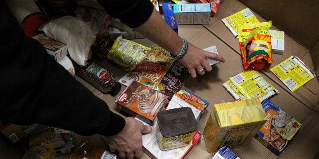 SAN FRANCISCO - NOVEMBER 23: Volunteers sort through food as they stock shelves at the San Francisco Food Bank November 23, 2009 in San Francisco, California. As the U.S. continues to struggle through the recession and unemployment is at record highs, food banks are seeing an increased demand as the holiday season approaches. (Photo by Justin Sullivan/Getty Images)