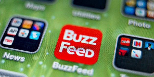 An icon for the BuzzFeed app is photographed on the home screen of an Apple Inc. iPhone 5 in Tiskilwa, Illinois, U.S., on Thu