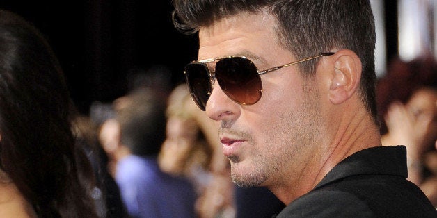 LOS ANGELES, CA - SEPTEMBER 25: Singer Robin Thicke arrives at the Los Angeles premiere of 'Baggage Claim' at Regal Cinemas