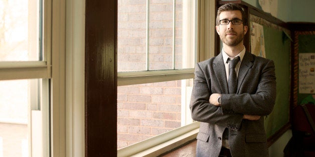 Young Male Teacher In Classroom