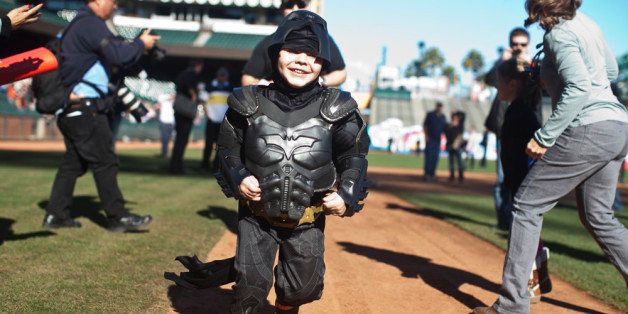 SAN FRANCISCO, CA - NOVEMBER 15: Leukemia survivor Miles, 5, dressed as BatKid, runs the bases as part of a Make-A-Wish foundation fulfillment at AT&T Park November 15, 2013 in San Francisco. The Make-A-Wish Greater Bay Area foundation turned the city into Gotham City for Miles by creating a day-long event bringing his wish to be BatKid to life. (Photo by Ramin Talaie/Getty Images)