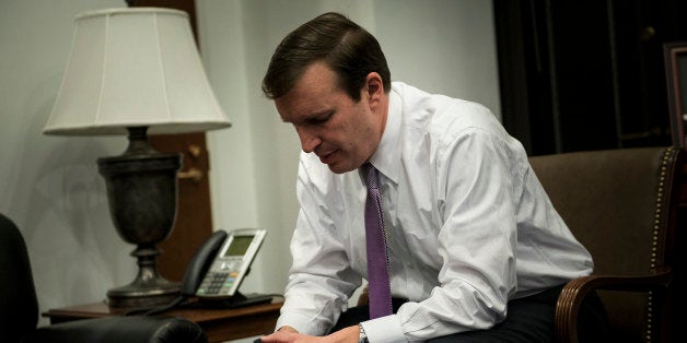 US Senator Chris Murphy, Democrat of Connecticut, sits during an interview in his office on Capitol Hill November 21, 2013 in Washington, DC. Murphy is planning to travel to Europe to discuss concerns over spying on US allies by the National Security Agency. AFP PHOTO/Brendan SMIALOWSKI (Photo credit should read BRENDAN SMIALOWSKI/AFP/Getty Images)