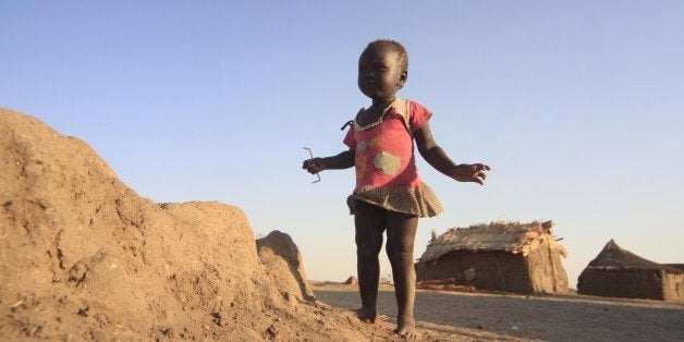 A young South Sudanese refugee stands at a Sudanese border checkpoint in Joda, where Sudan's White Nile state meets the South