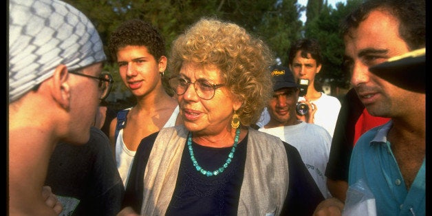 Controversial (left-leaning Meretz bloc), outspoken Min. of Education Shulamit Aloni (C) w. students on campus of Givat Haviv