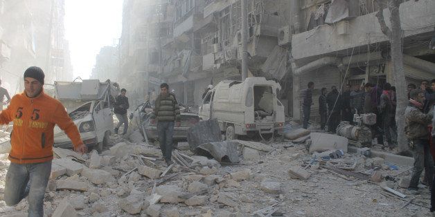 ALEPPO, SYRIA - FEBRUARY 3: At least 24, including four children, were killed on Monday as Syrian army helicopters dropped barrel bombs on opposition-controlled areas in Aleppo, February 3, 2014. (Photo by Ahmed Muhammed Ali/Anadolu Agency/Getty Images)