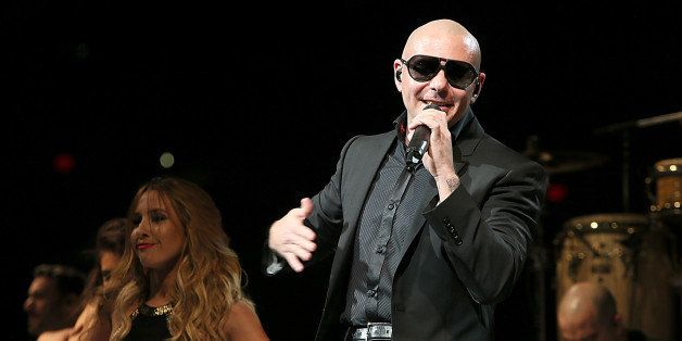 SAN ANTONIO, TX - FEBRUARY 19: Pitbull performs in concert during the San Antonio Stock Show And Rodeo at the AT&T Center on February 19, 2014 in San Antonio, Texas. (Photo by Gary Miller/FilmMagic)
