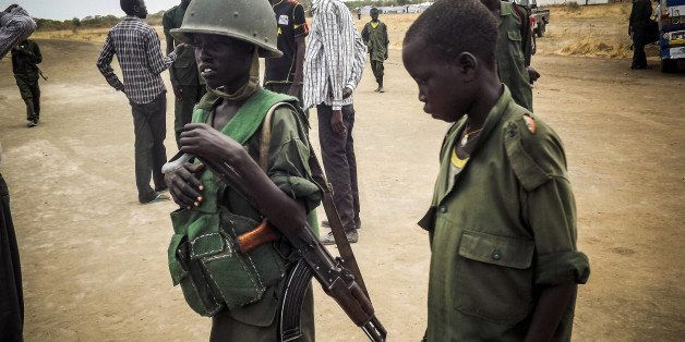 SOUTH SUDAN - MARCH 3: Child soldier is seen in military uniform in the South Sudan Democratic Movement/Army (SSDM/A), Jonglei State, South Sudan on March 1, 2014. (Photo by Samir Bor/Anadolu Agency/Getty Images)