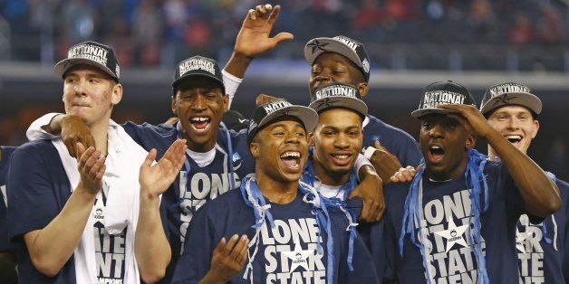 UConn celebrates as the Connecticut Huskies beat the Kentucky Wildcats 60-54 in the NCAA Final Four championship game at AT&T Stadium in Arlington, Texas, Monday, April 7, 2014. (Ron Jenkins/Fort Worth Star-Telegram/MCT via Getty Images)