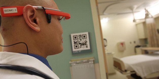 BOSTON - APRIL 8: Dr. Steven Horng, at Beth Israel Deaconess Hospital, demonstrates what it will look like for Emergency Room doctors to use Google Glass to read the QR code and patient records outside of the patient's room. Horng launched a Google Glass pilot program at Beth Israel Deaconess Medical Center late last year. (Photo by Suzanne Kreiter/The Boston Globe via Getty Images)