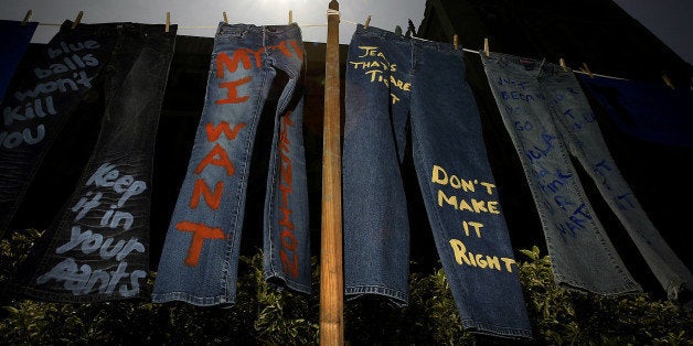 LOS ANGELES - APRIL 21: Blue jeans with messages challenging misconceptions about sexual violence are hung by the UCLA Clothesline Project on the University of California Los Angeles campus during Denim Day April 21, 2004 in Los Angeles, California. The UCLA Clothesline Project is a student organization which works to stop gender-based violence. In 1999, wearing jeans on Denim Day during Sexual Assault Awareness Month became an international symbol of protest against rape in response to an Italian Supreme Court decision, which overturned a rape conviction because the victim wore jeans. The Italian Court justices reasoned that the victim must have helped her attacker remove her jeans because they believed that without the victim's help, removing the jeans would be impossible. (Photo by David McNew/Getty Images)