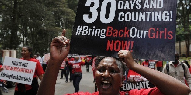 Activists from a coalition of more than 40 African women organisations march on May 15, 2014 in the streets of Kenya's capital Nairobi demanding the release of more than 200 schoolgirls abducted from schools in nothern Nigeria by muslim extremist group Boko-haram. The Islamist group, whose name roughly translates from the Hausa language spoken widely in northern Nigeria as 'Western education is forbidden' claimed responsibility for kidnapping more than 200 schoolgirls, threatening to sell them like slaves and force them into marriage unless Nigeria freed militants held in the country's jails. Nigeria's President has ruled out today the release of Boko Haram fighters in exchange for the freedom of the schoolgirls kidnapped by the militants a month ago. AFP PHOTO/ TONY KARUMBA (Photo credit should read TONY KARUMBA/AFP/Getty Images)