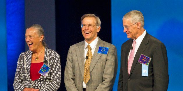 The Walton siblings from left, Alice Walton, Jim Walton and Wal-Mart Chairman Rob Walton, the children of the late Wal-Mart Stores Inc. founder Sam Walton, appear on stage during the company's annual shareholder meeting in Fayetteville, Arkansas, U.S., on Friday, June 3, 2011. Wal-Mart Stores Inc. renewed plans to buy back as much as $15 billion of its shares, potentially bolstering the Walton family's control of the world's largest retailer. Photographer: Beth Hall/Bloomberg via Getty Images