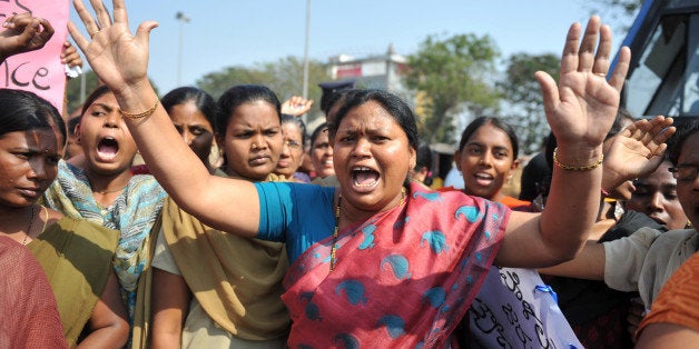 Indian students of various organisations hold placards as they shout slogans during a demonstration in Hyderabad on January 3, 2013. A gang of men accused of repeatedly raping a 23-year-old student on a moving bus in New Delhi in a deadly crime that repulsed the nation are to appear in court for the first time. Police are to formally charge five suspects with rape, kidnapping and murder after the woman died at the weekend from the horrific injuries inflicted on her during an ordeal that has galvanised disgust over rising sex crimes in India. AFP PHOTO/Noah SEELAM (Photo credit should read NOAH SEELAM/AFP/Getty Images)