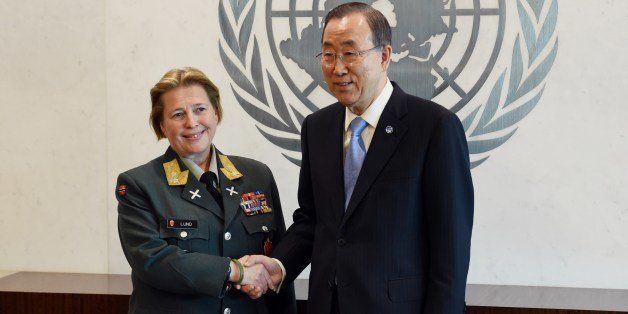 Major General Kristin Lund of Norway (L) shakes hands with United Nations Secretary General Ban Ki-Moon on May 12, 2014 at UN headquarters in New York. Major General Lund has been appointed as the new head of the UN military peacekeeping force in Cyprus (UNFICYP), and will be the first ever female military commander of a UN peacekeeping force. AFP PHOTO/Stan HONDA (Photo credit should read STAN HONDA/AFP/Getty Images)