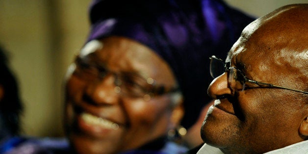 Archbishop Emeritus Desmond Tutu (R) smiles, as his wife Leah (L) smiles at him during the launch of Tutu'sauthorised biograp