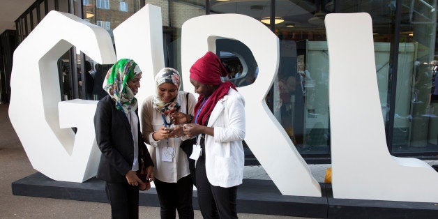 LONDON, ENGLAND - JULY 22: Delegates relax between sessions at the 'Girl Summit 2014' in Walworth Academy on July 22, 2014 in London, England. At the one-day summit the government has announced that parents will face prosecution if they fail to prevent their daughters suffering female genital mutilation (FGM). (Photo by Oli Scarff/Getty Images)